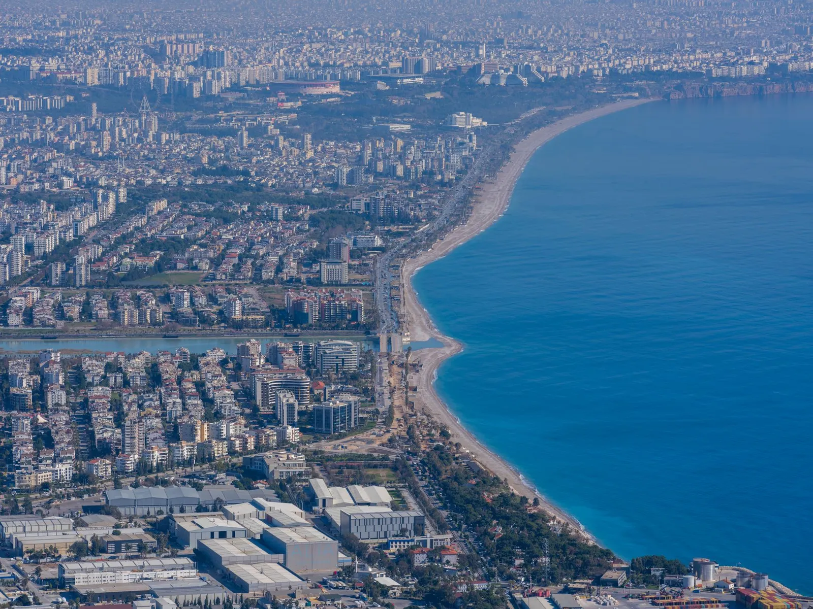 Stunning aerial shot of Antalya's urban skyline along Konyaalti Beach.