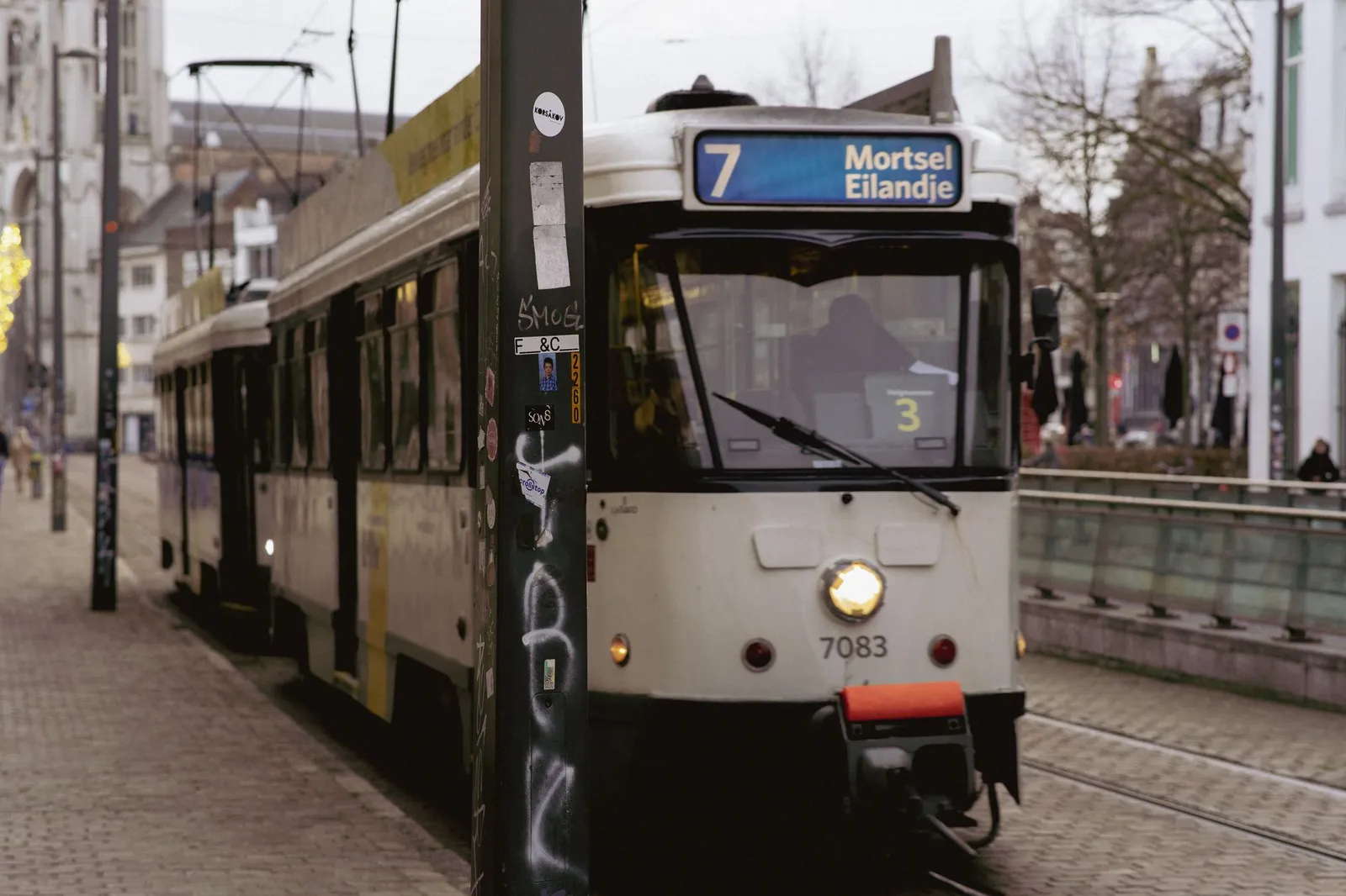 A classic tram on line 7 in Antwerp heading to Mortsel Eilandje, capturing city life.