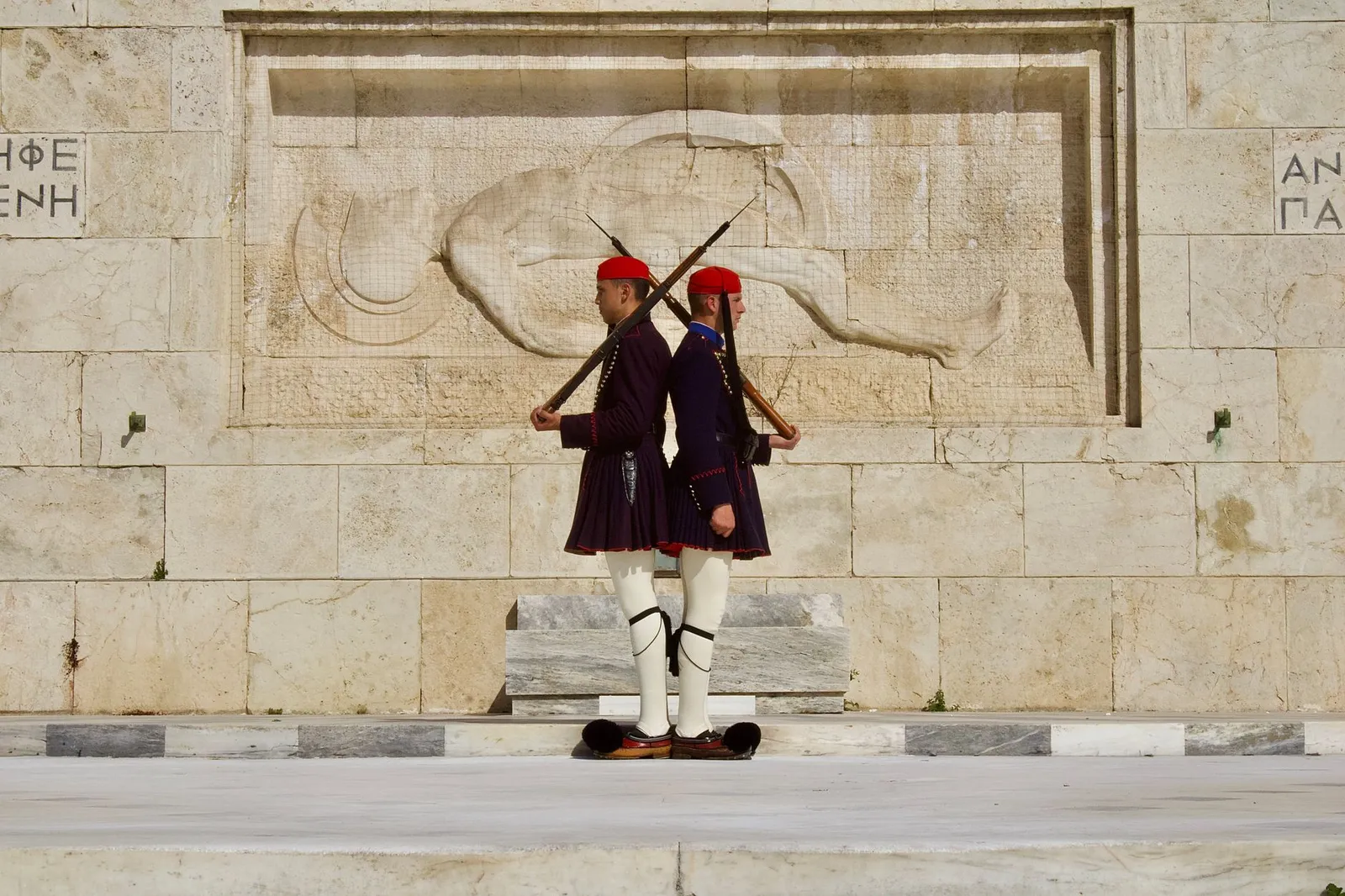 A traditional changing of the guard ceremony performed by the Evzones at the Tomb of the Unknown Soldier in Athens.
