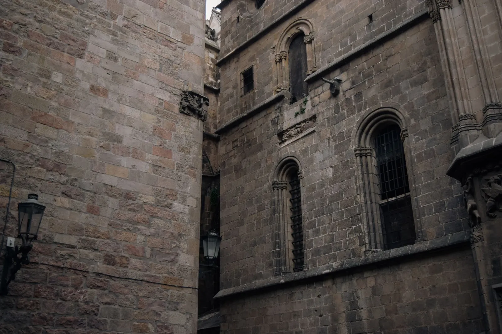 Medieval Gothic buildings in Barcelona, showcasing intricate stonework and historic charm.