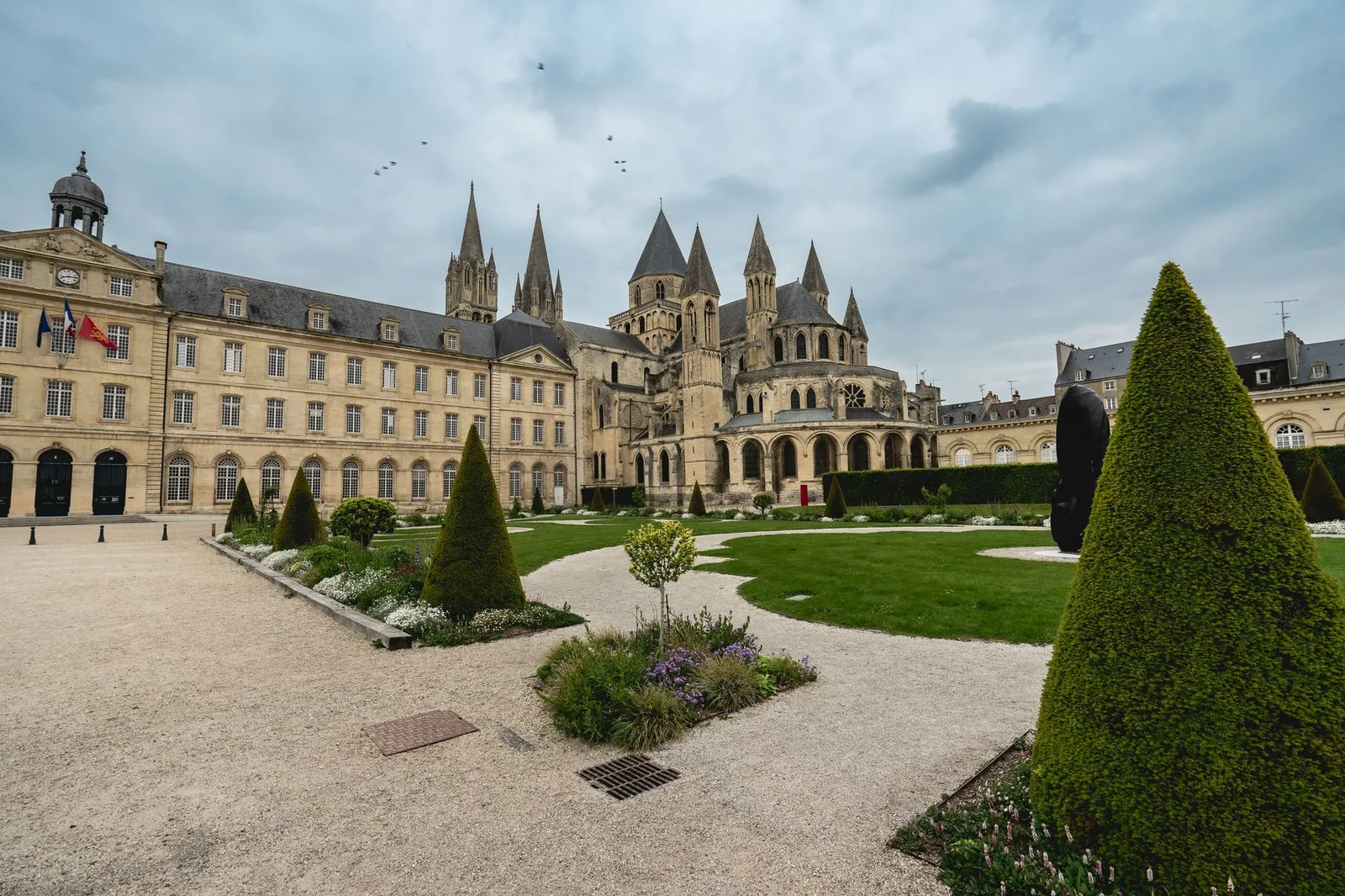 Explore the majestic Abbey of Saint-Étienne in Caen, a blend of gothic architecture and lush gardens.