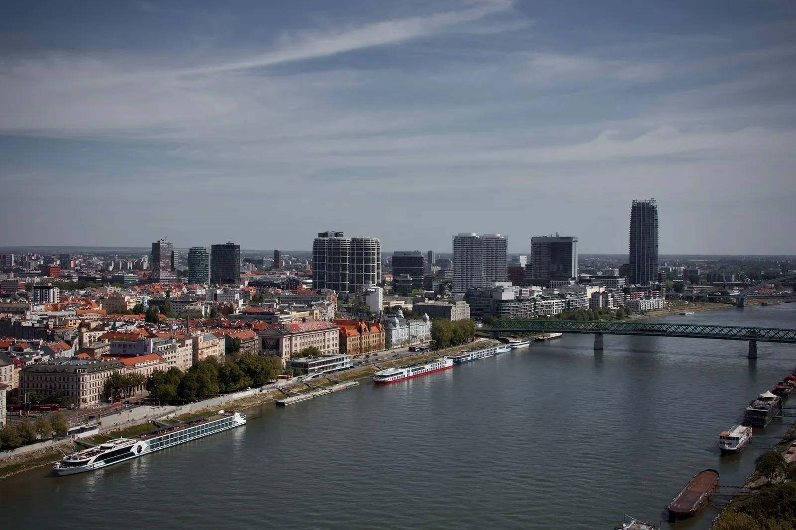 Stunning aerial view of Bratislava's skyline with modern architecture and the Danube River.
