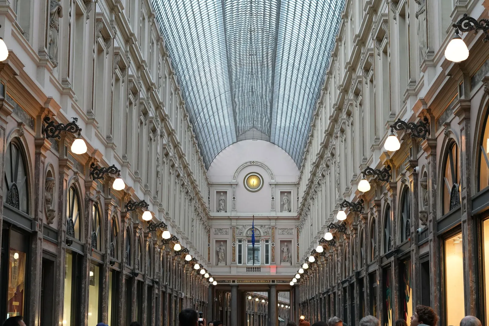 View of the stunning architecture and glass ceiling of Galeries Royales Saint-Hubert in Brussels.