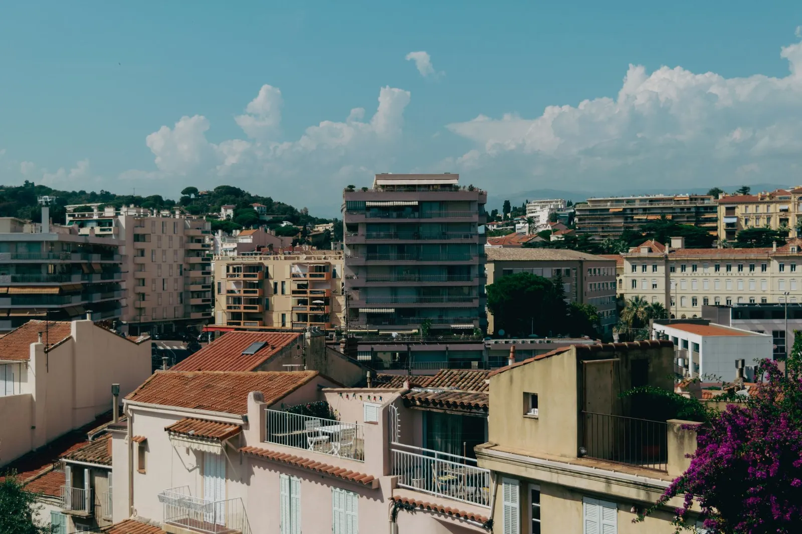 Scenic view of Cannes with Mediterranean-style buildings and a clear sky.
