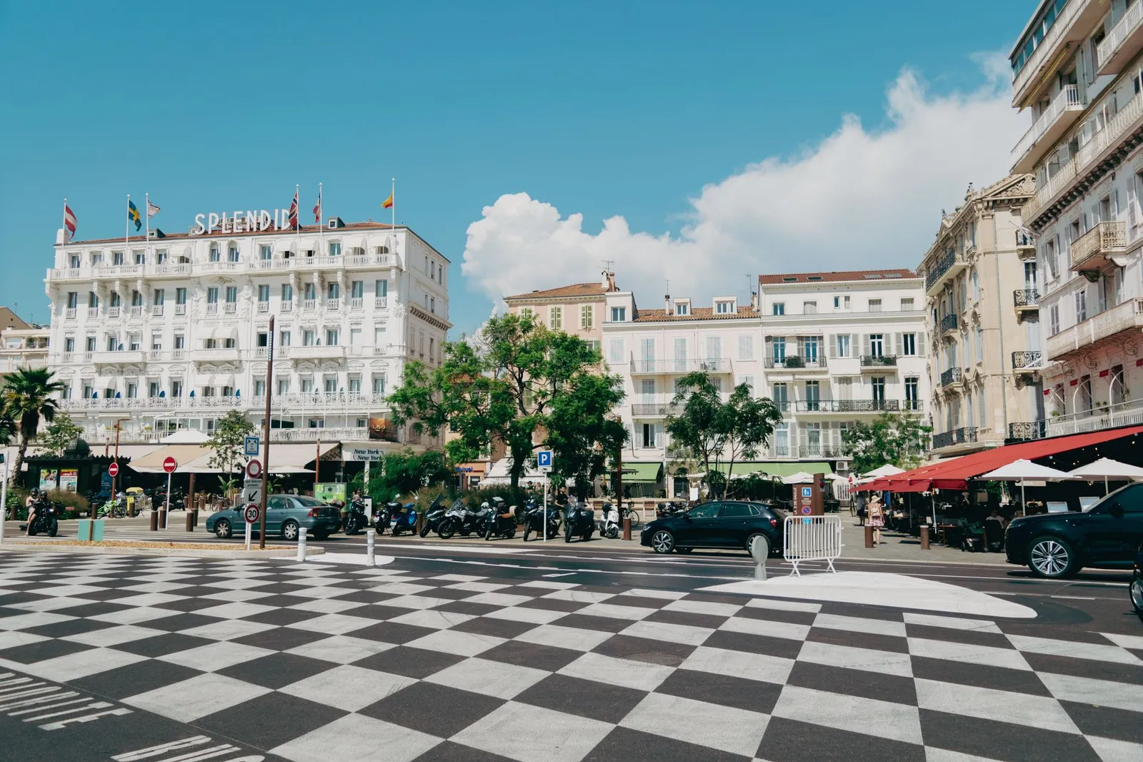 Elegant street view of Cannes with historic architecture and vibrant atmosphere.