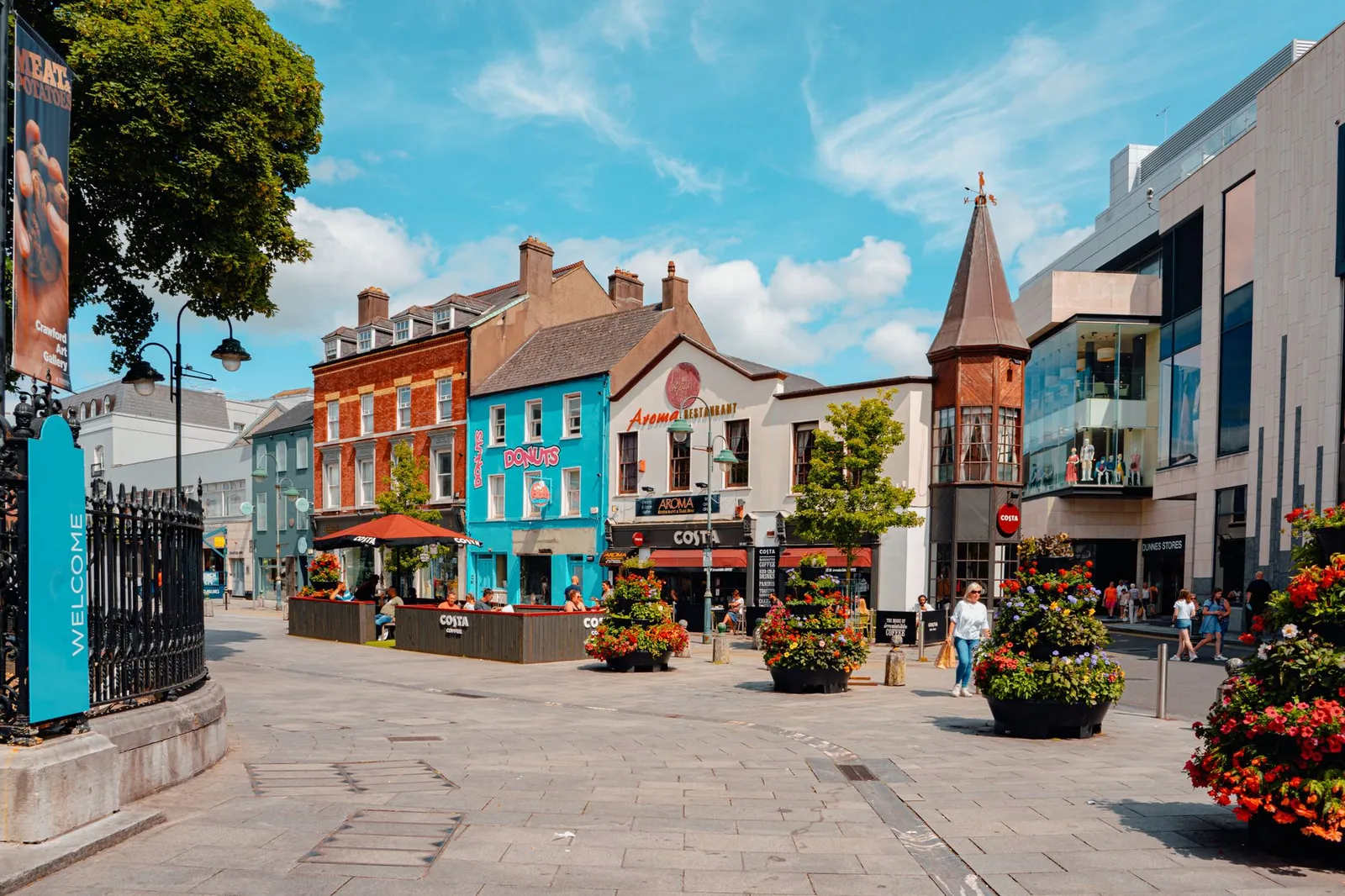 Colorful buildings and lively street scene in Cork, Ireland.