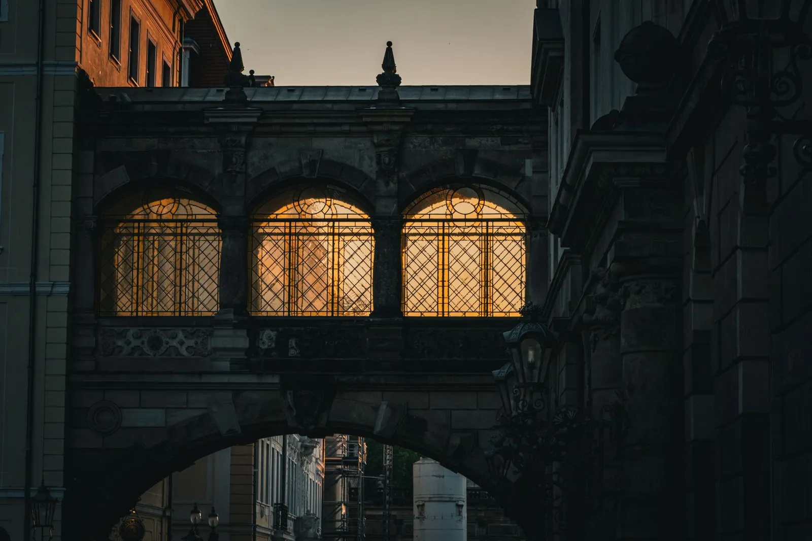 Sunset light illuminating a historic archway in Dresden, Germany's old town.