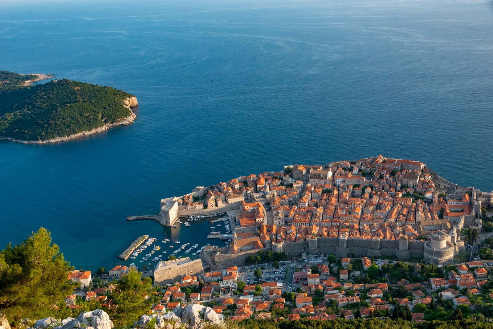 Aerial shot of Dubrovnik's historic Old Town with Gothic architecture by the Adriatic Sea.