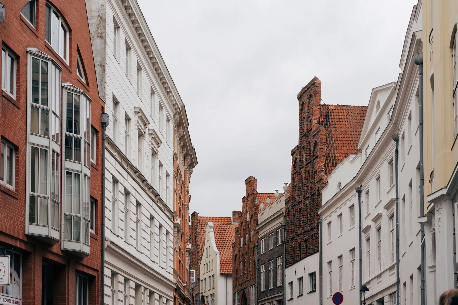 Explore the historic architecture and cobbled streets of Lübeck, Germany, showcasing iconic brick facades.