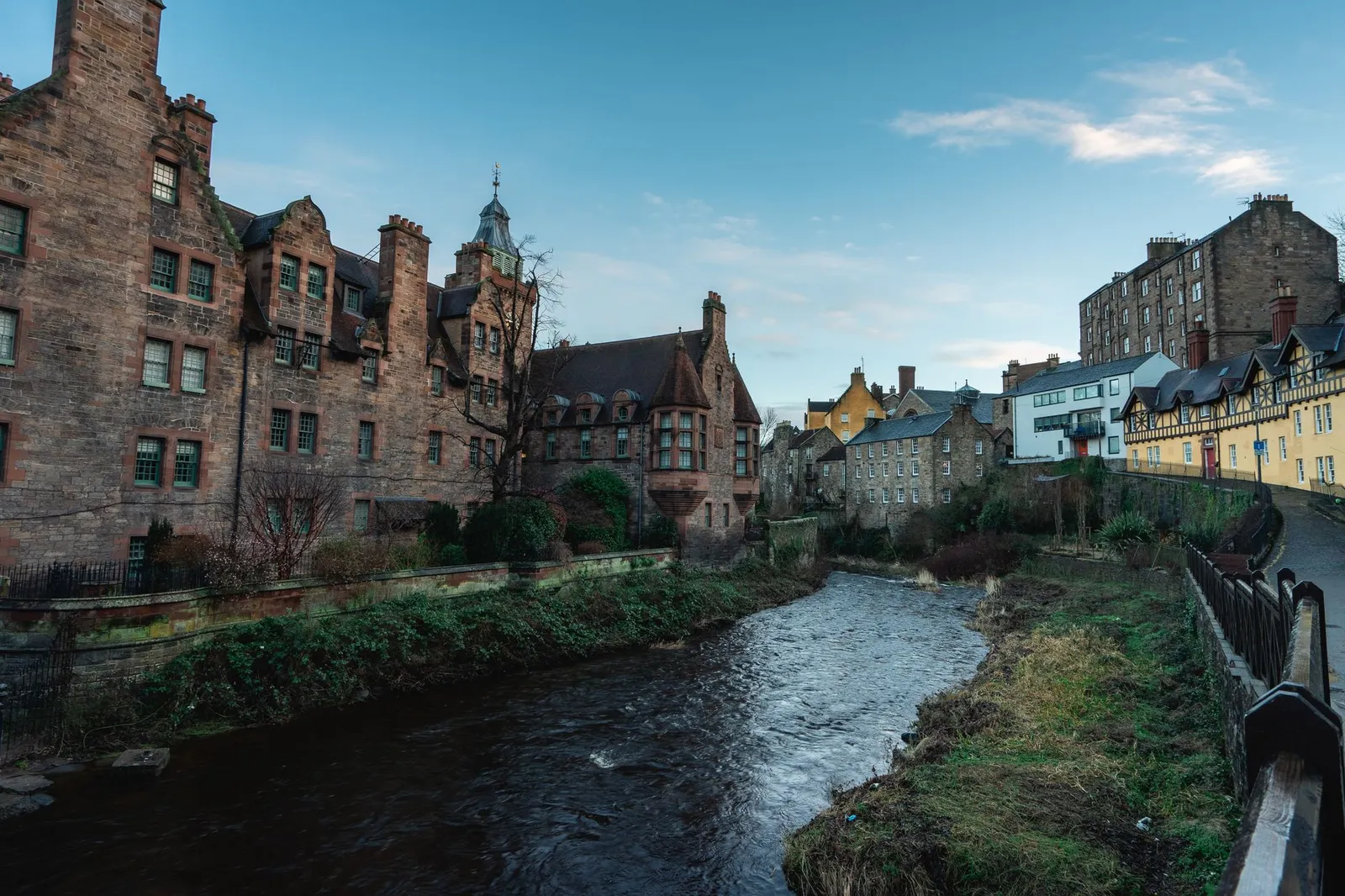 Charming view of historic buildings along the Water of Leith in Edinburgh's Dean Village.