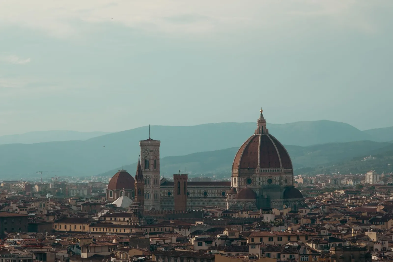 Explore the breathtaking aerial view of Florence featuring the iconic Cathedral of Santa Maria del Fiore.