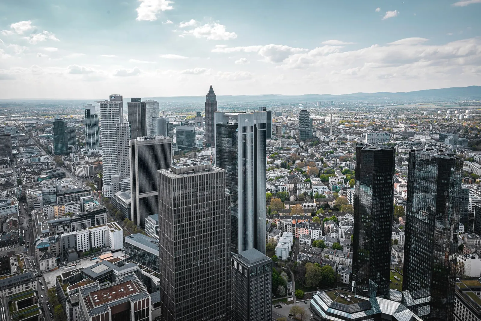 Aerial view of Frankfurt am Main's modern skyline on a clear day.