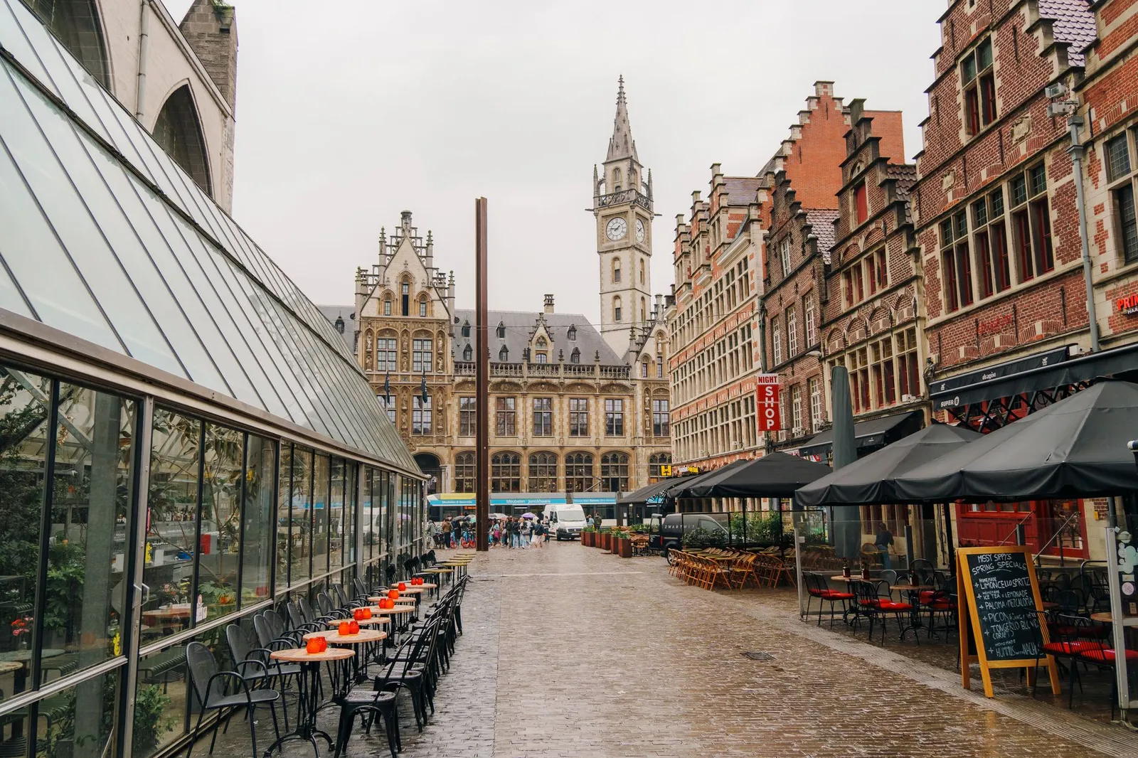 Explore a picturesque street in Ghent, Belgium, featuring iconic architecture and a lively atmosphere.