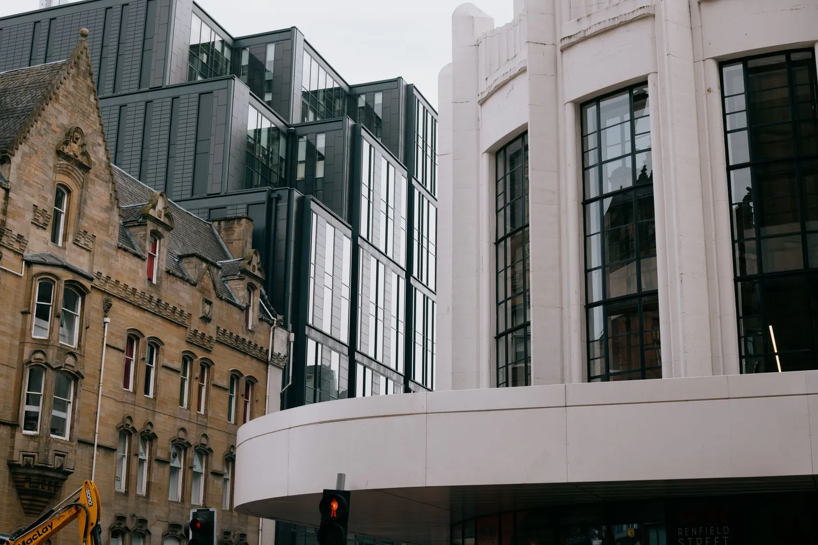 A blend of modern and Victorian architecture in Glasgow, Scotland, showcasing urban contrast.