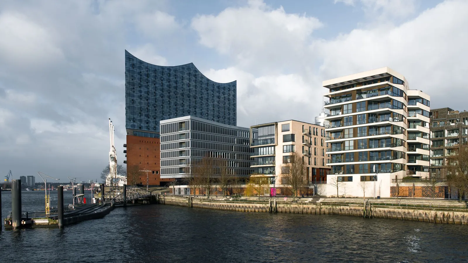 Panoramic view of Elbphilharmonie in Hamburg's HafenCity with modern architecture.
