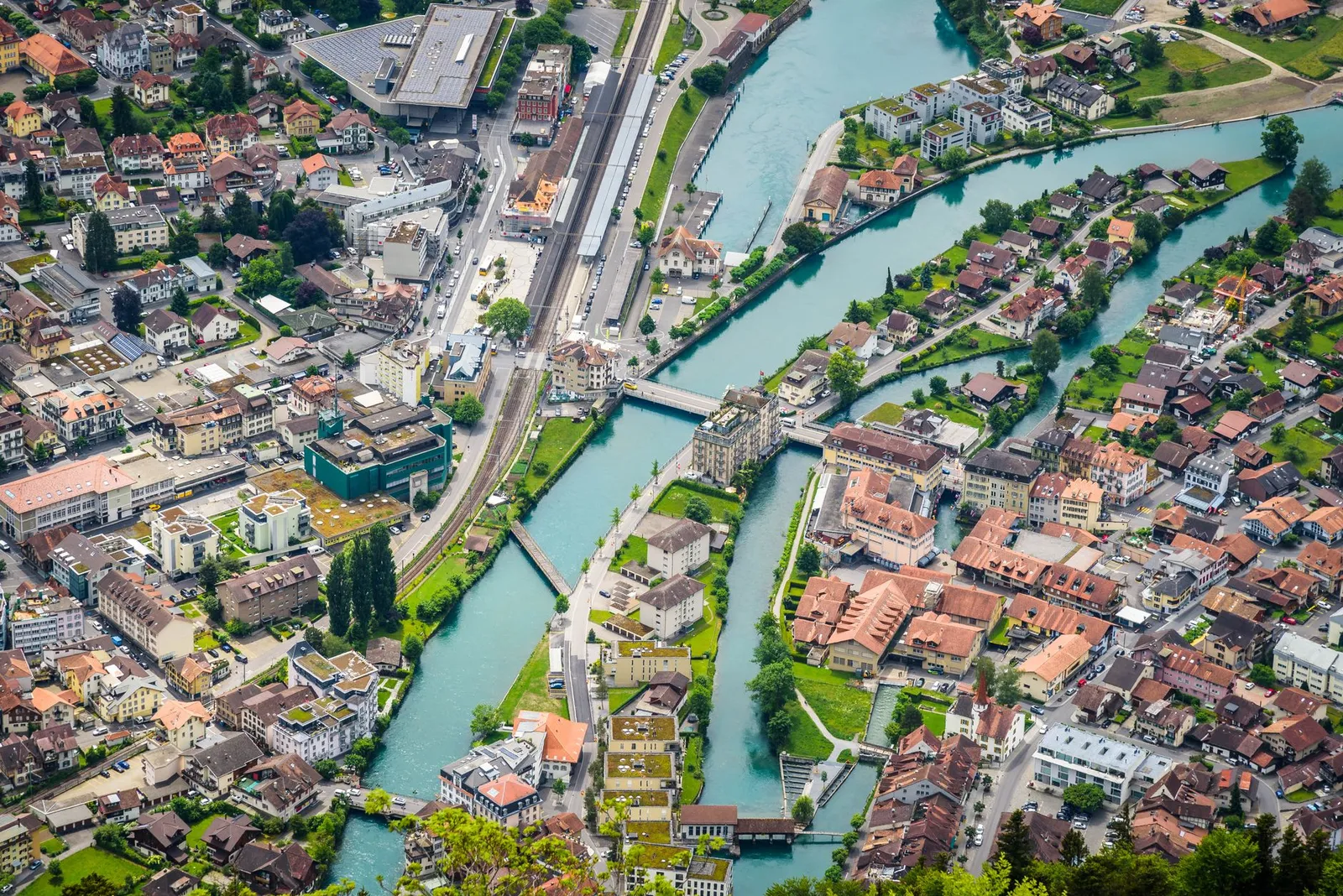 A breathtaking aerial view of Interlaken's canals and cityscape in Switzerland, showcasing its charming architecture.