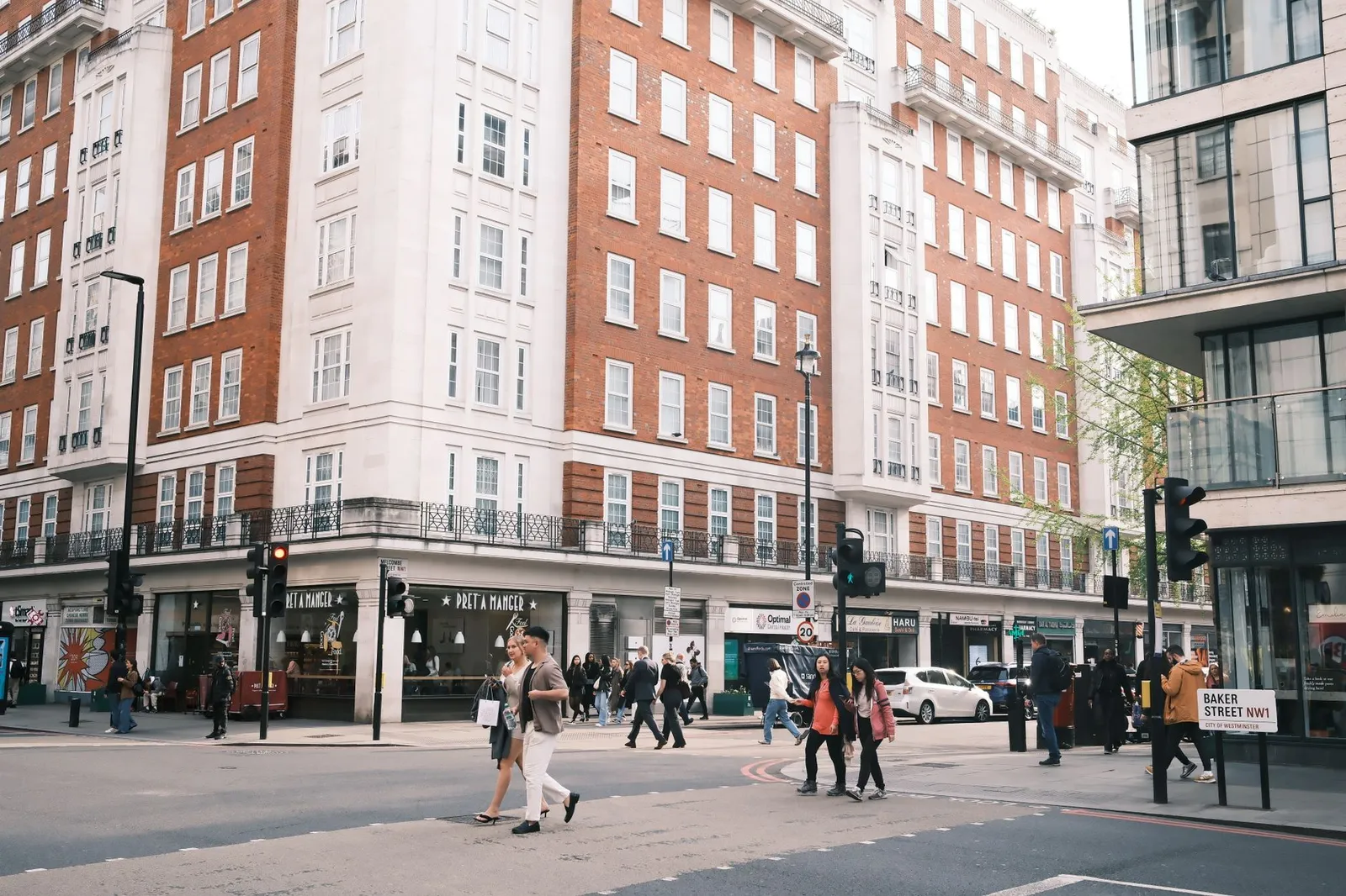 A bustling street scene at Baker Street, London, capturing urban life and architecture.