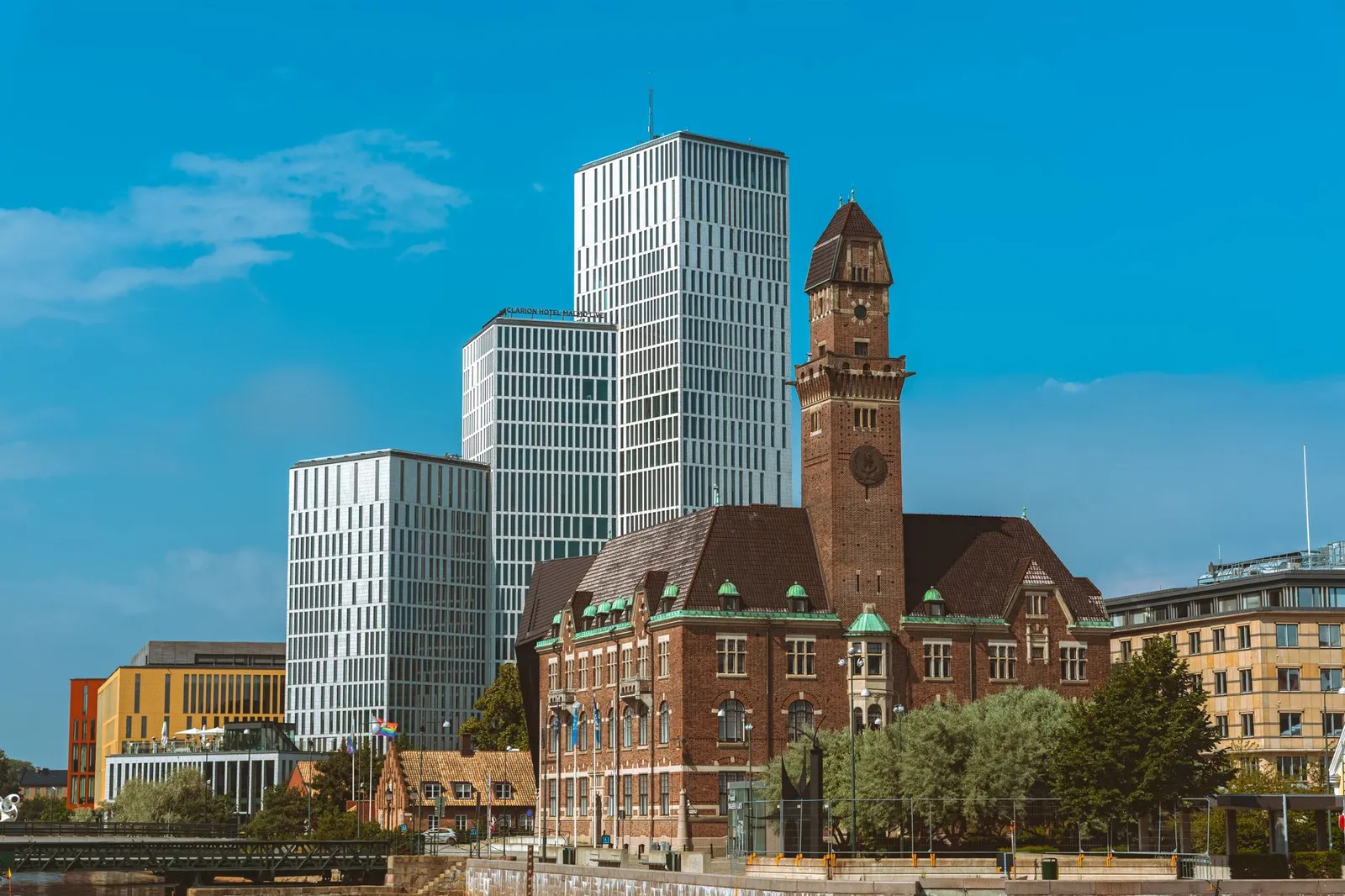 A striking contrast of modern skyscrapers and historic architecture in Malmö, Sweden.