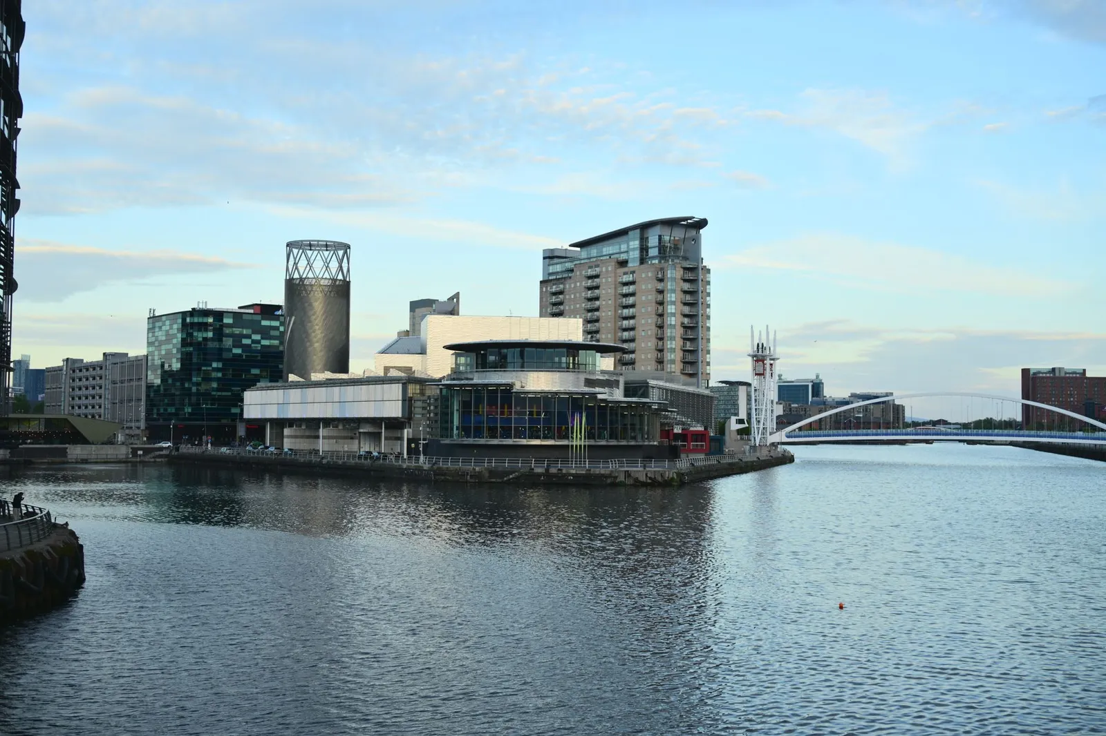 Skyline view of modern architecture along the waterfront in Manchester, UK.