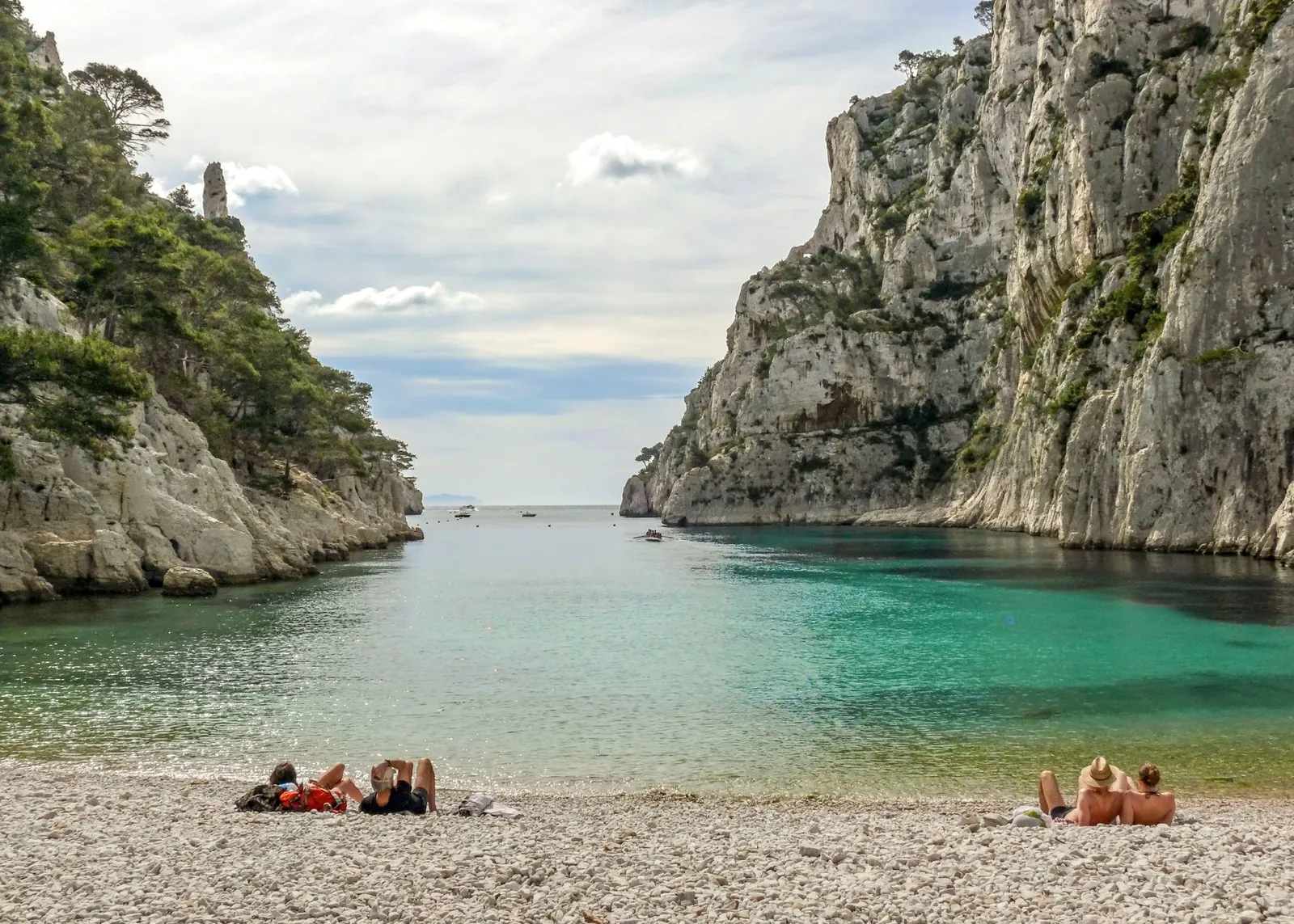 A serene day at Calanque beach with turquoise waters and dramatic cliffs in Marseille, France.