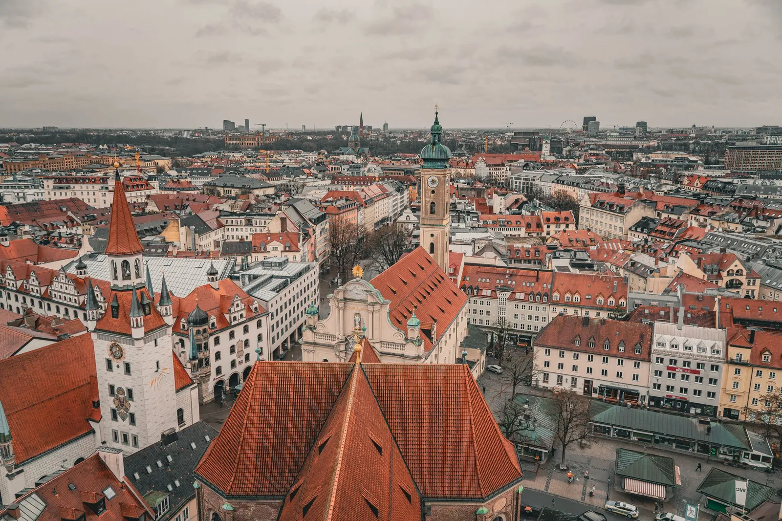 Aerial photo showcasing the historic architecture and vibrant rooftops of Munich's old town.