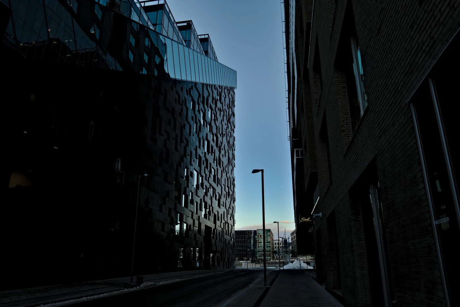 A striking view of contemporary buildings in Oslo as night falls, showcasing urban geometry.