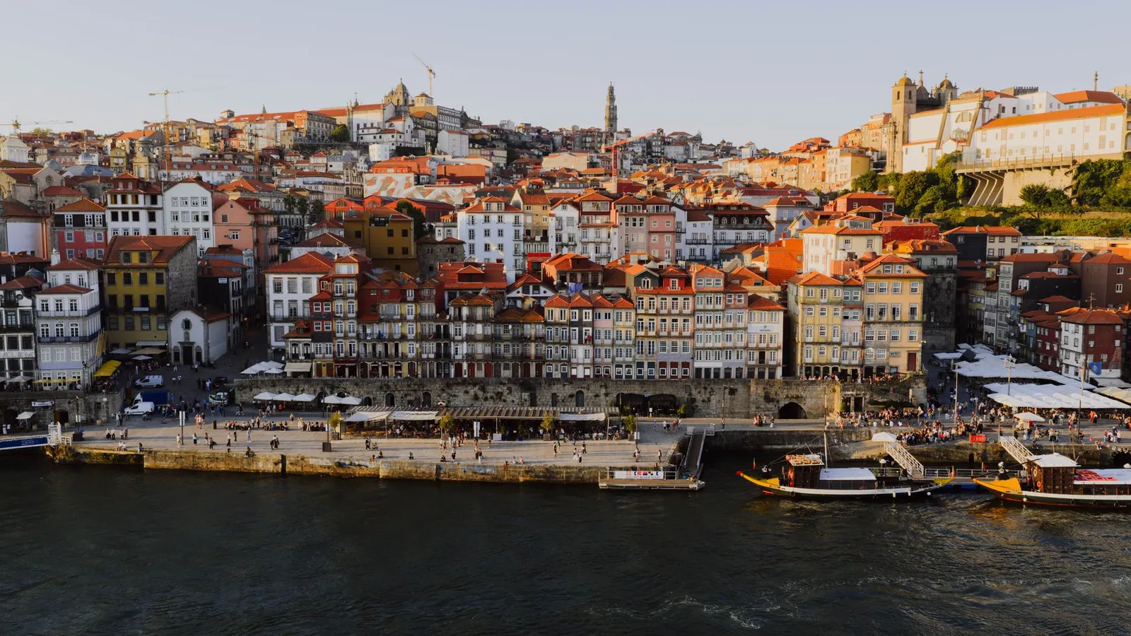 Experience the vibrant architecture of Porto's Ribeira District from above at sunset.