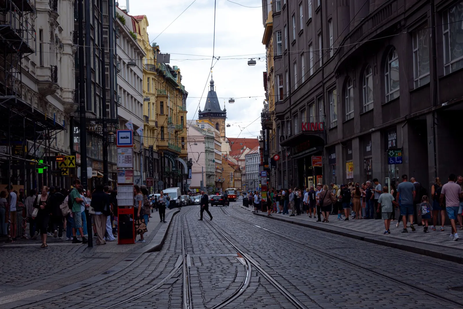 Explore the bustling streets of Prague with tram lines and historic architecture in this urban snapshot.