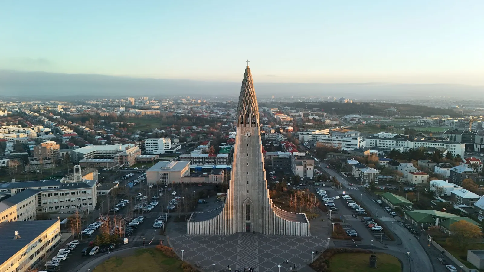 Stunning aerial shot of Hallgrímskirkja in Reykjavik, Iceland, at sunrise showcasing the city's architecture.