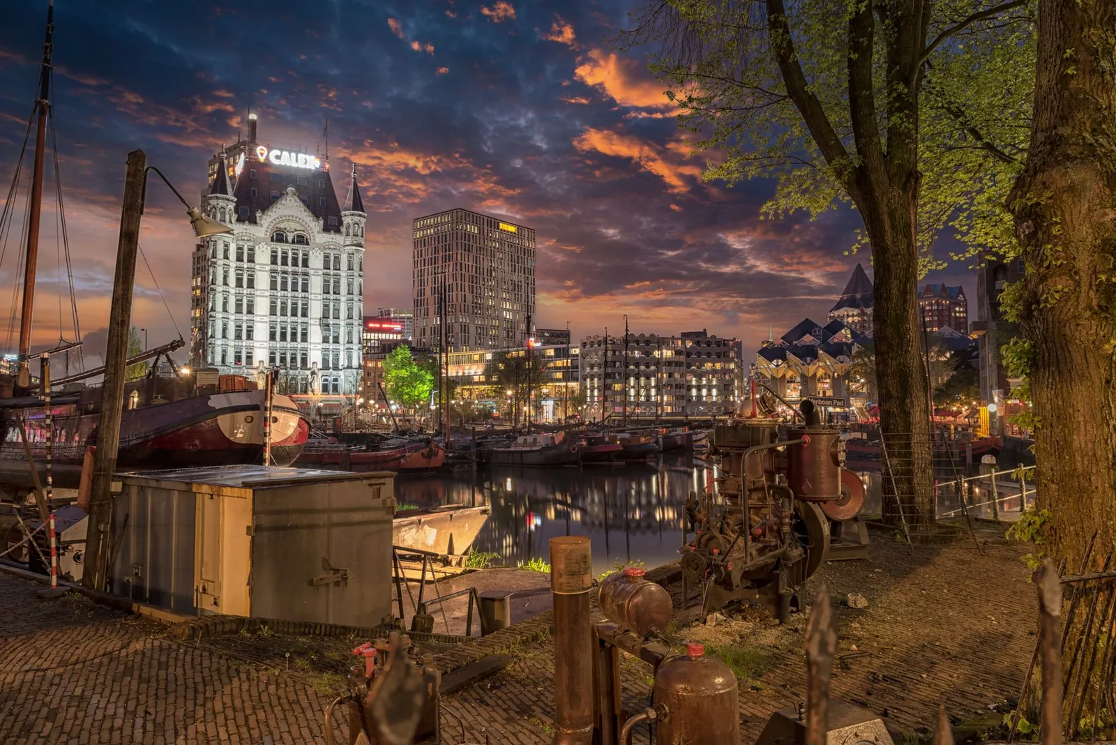 Beautiful evening cityscape view of Rotterdam's canals and historic architecture.