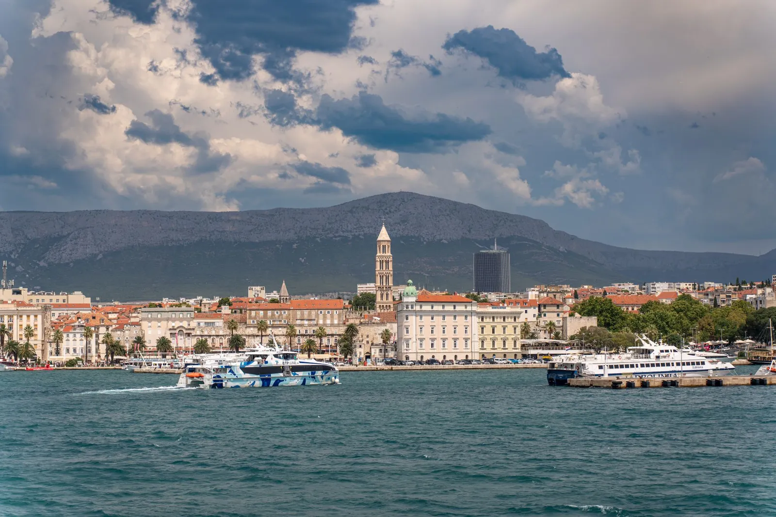Explore the historic waterfront of Split, Croatia, featuring Diocletian's Palace and bustling harbor.