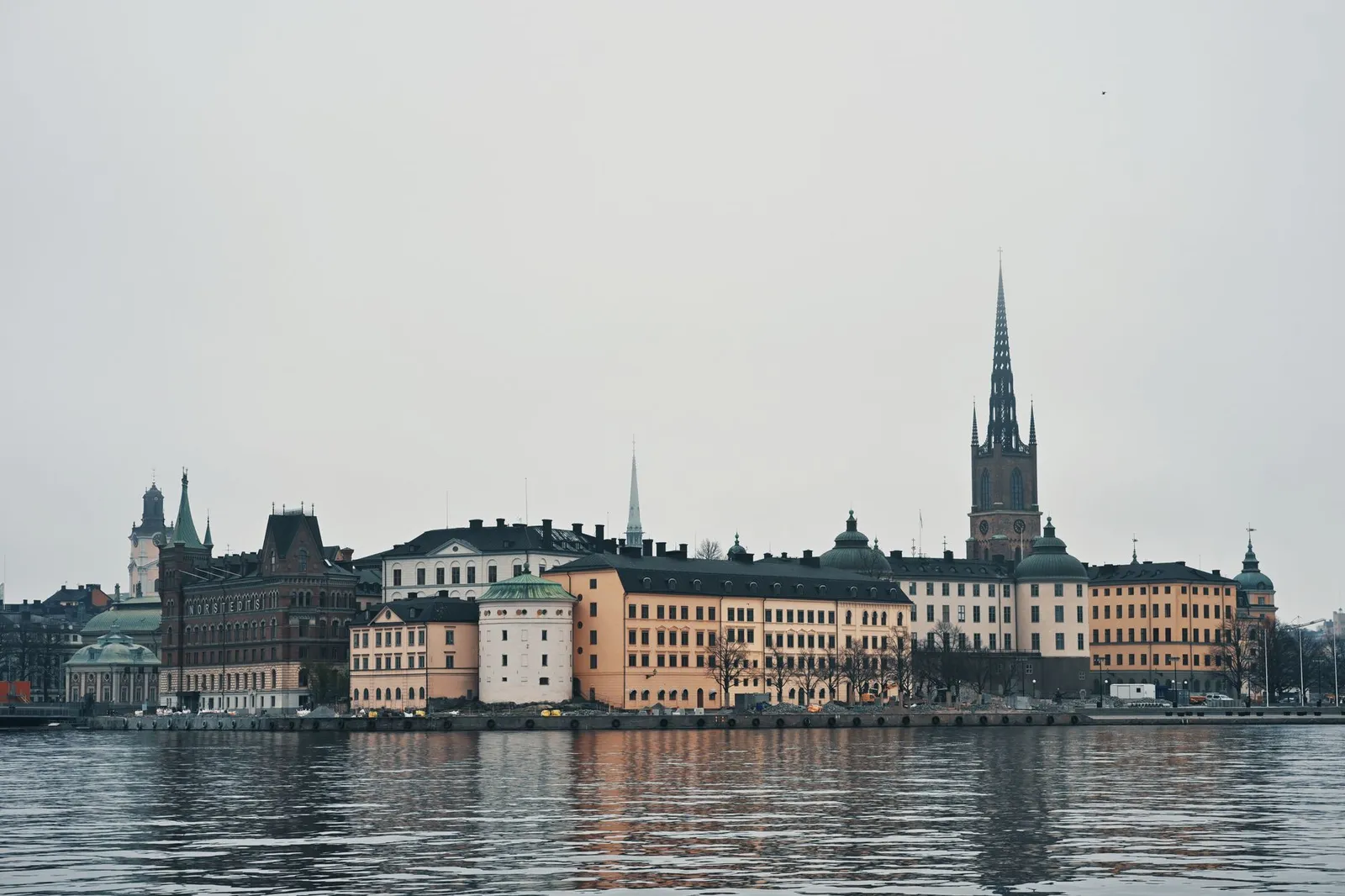 Explore the historic beauty of Gamla Stan in Stockholm, Sweden, featuring iconic spires and architecture.