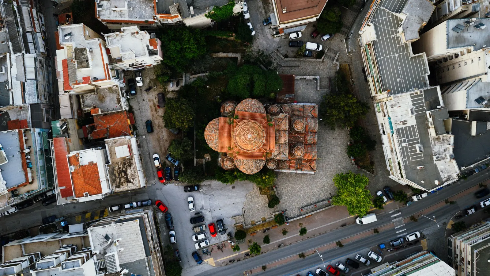 A dynamic aerial shot of the Rotunda Church in Thessaloniki, Greece, showcasing its architectural beauty.