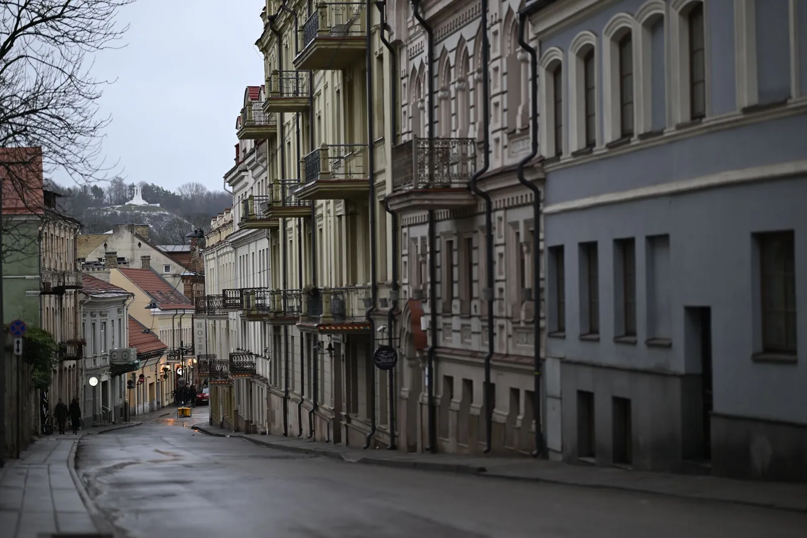 Elegant street view of historical townhouses in Vilnius' Old Town, Lithuania.