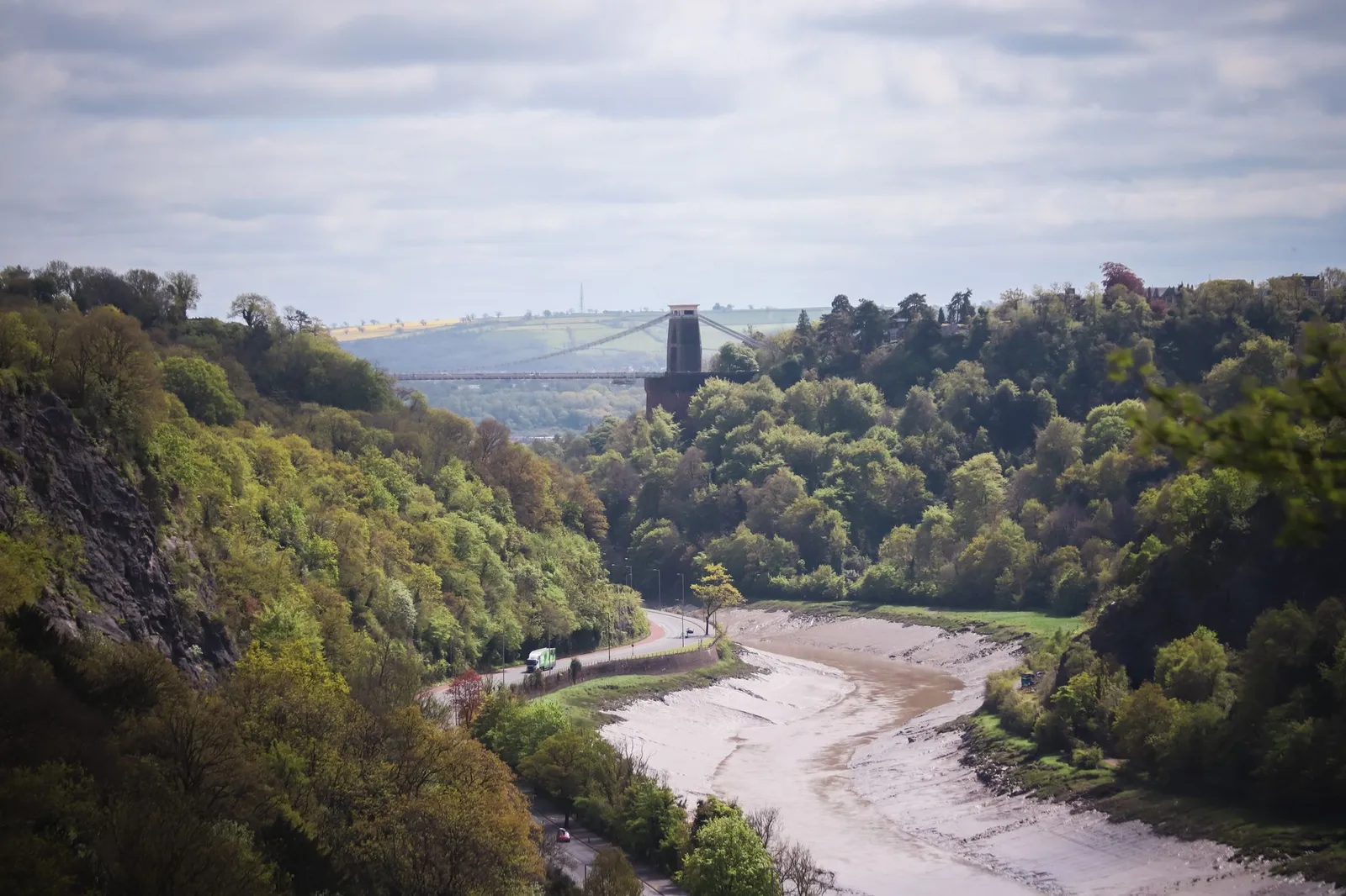 A scenic view of the Clifton Suspension Bridge spanning the Avon Gorge in Bristol, England.
