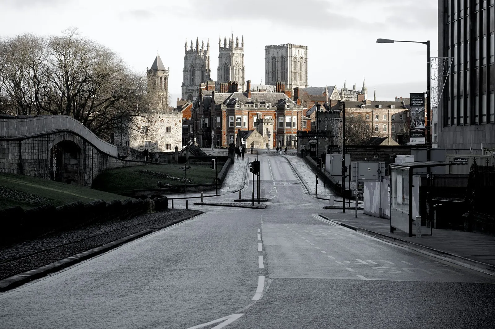 A striking shot of York Minster framed by an empty city street, highlighting historic architecture.