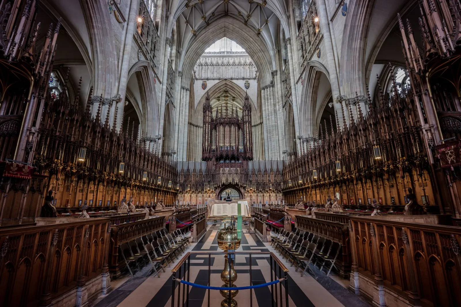 Explore the majestic Gothic architecture of York Minster's ornate choir, showcasing England's rich heritage.