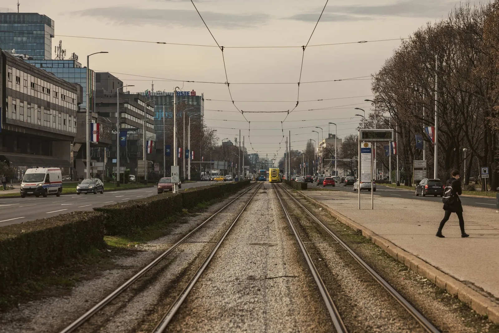 Urban landscape with tram tracks and city street in Zagreb, Croatia, during day.
