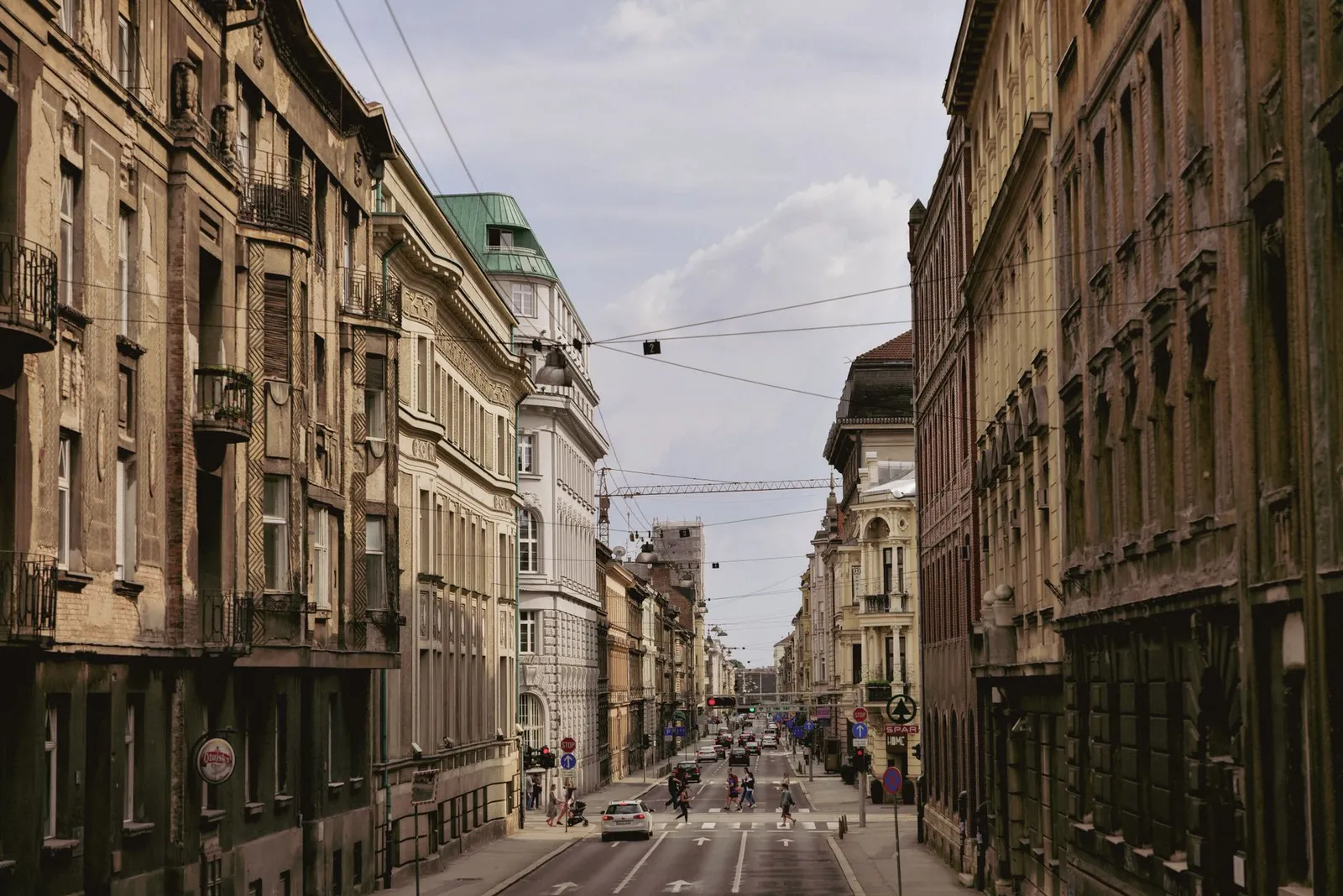 A vibrant street scene showcasing the historic architecture of Zagreb, Croatia's city center.